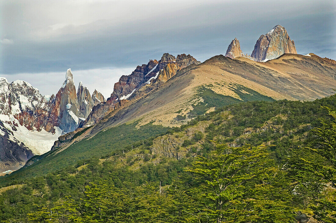 Mountain peaks of Cerro Torre and Mt FitzRoy range in the Southern Andes, Cerro Torre (3102 metres/10205ft) on the left and Mt Fitz Roy 3405 metres/11202 ft) summit on the far right, near El Chalten in Parque Nacional Los Glaciares; Patagonia, Argentina