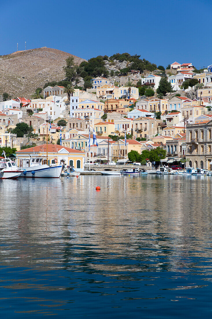 Sunny day on the waterfront at Gialos Harbor, Symi (Simi) Island; Dodecanese Island Group, Greece
