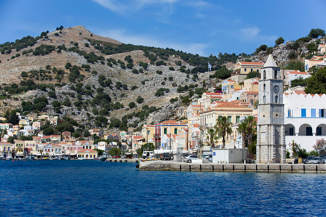 Symi Clock Tower on the waterfront at Gialos Harbor, Symi (Simi) Island; Dodecanese Island Group, Greece
