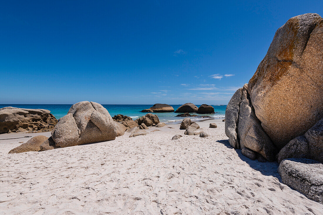 Large boulders and sandy beach at Clifton Beach on the Atlantic Ocean in Cape Town; Cape Town, Western Cape, South Africa