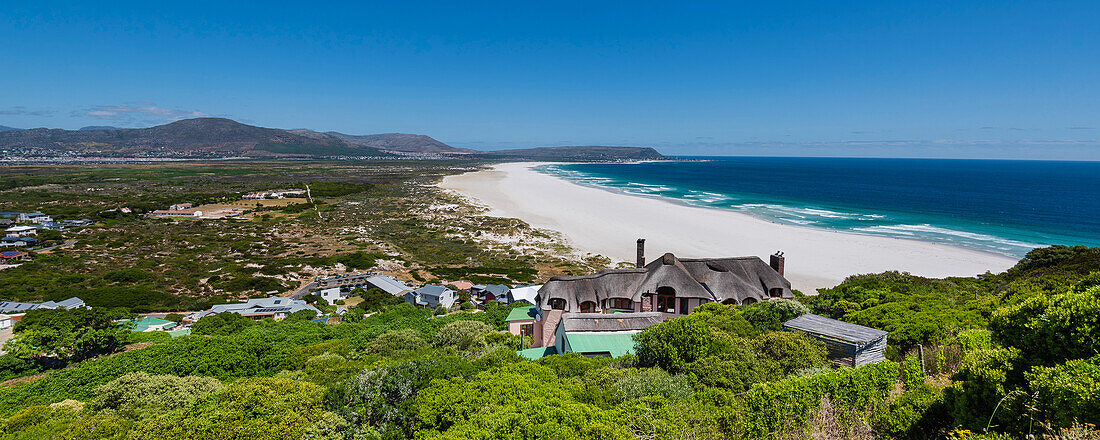 Coastal community of Noordhoek Beach near Chapman's Peak along the shoreline of the Atlantic Ocean; Cape Town, Western Cape, South Africa