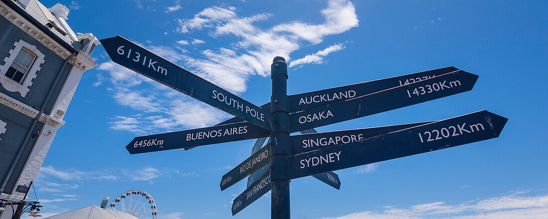 Sign Post, directional sign with the distance to various locations on the  Victoria and Alfred Waterfront in Cape Town; Cape Town, Western Cape, South Africa