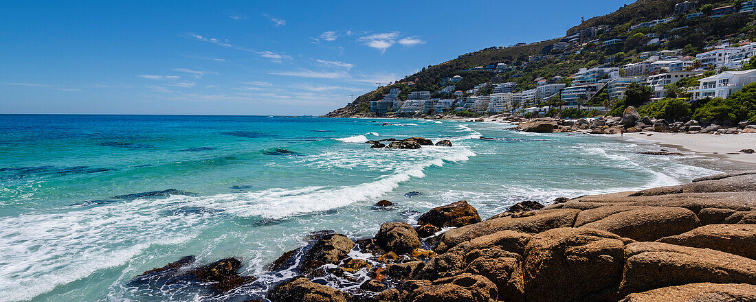 Atlantic ocean and rocky coast along the shore of the Cape Town suburb of Clifton at Clifton Beach; Cape Town, Western Cape, South Africa