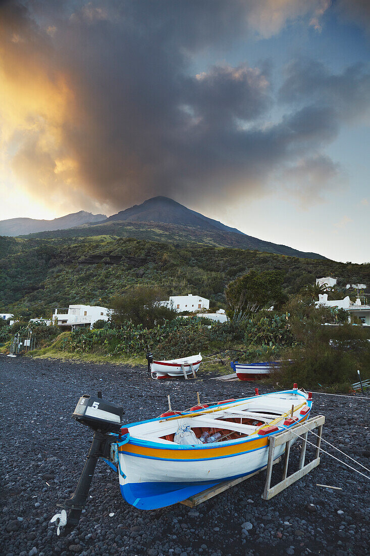 Stromboli volcano smouldering at sunset; Sicily, southern Italy.; Scari, Stromboli island, Aeolian islands, Sicily, Italy.