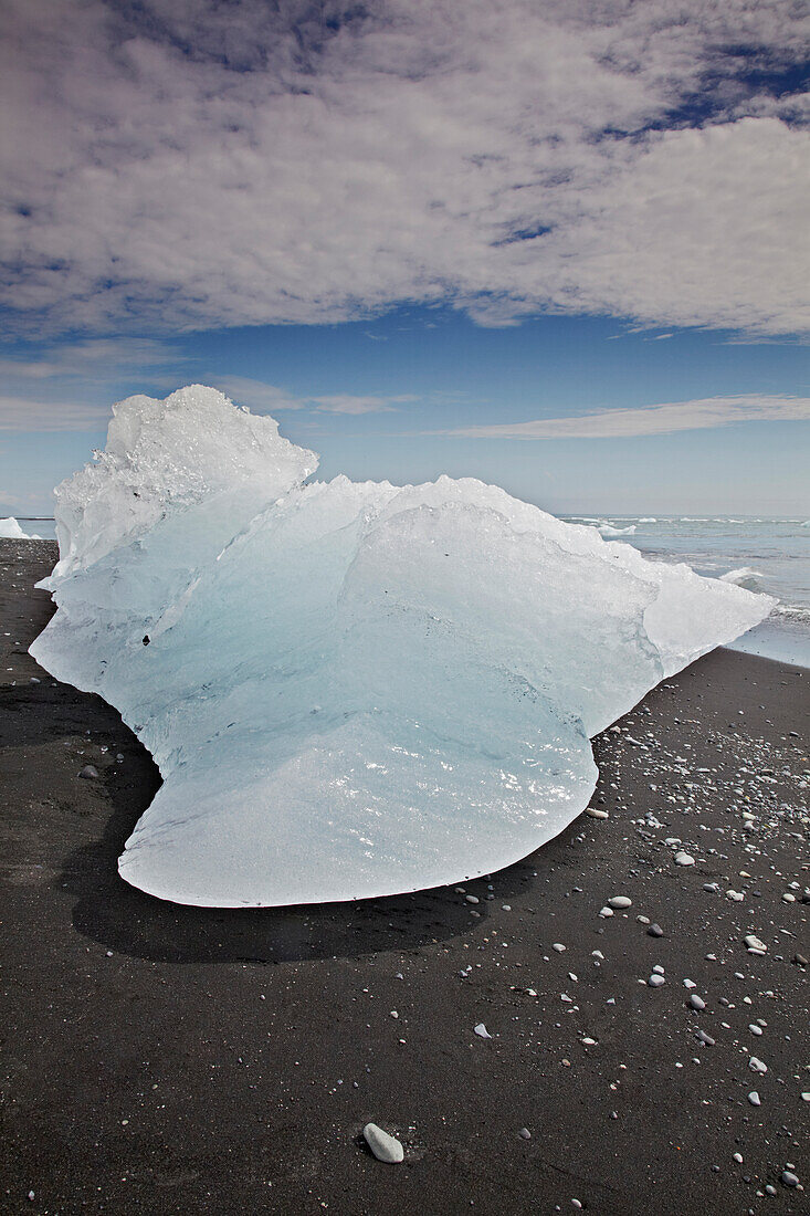 An iceberg beached after coming from the Vatnajokull icecap, Iceland.; Jokulsarlon, Vatnajokull icecap, Iceland.
