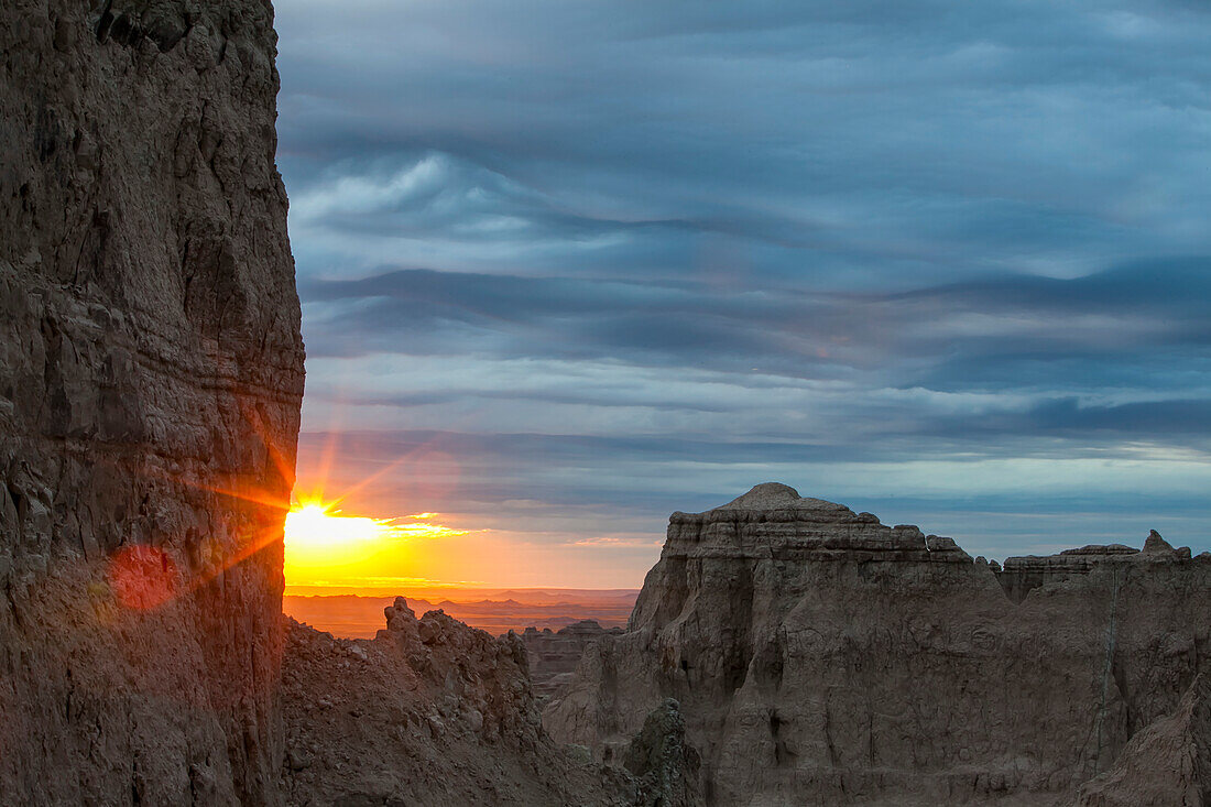 The sun rises over Badlands National Park; South Dakota, United States of America
