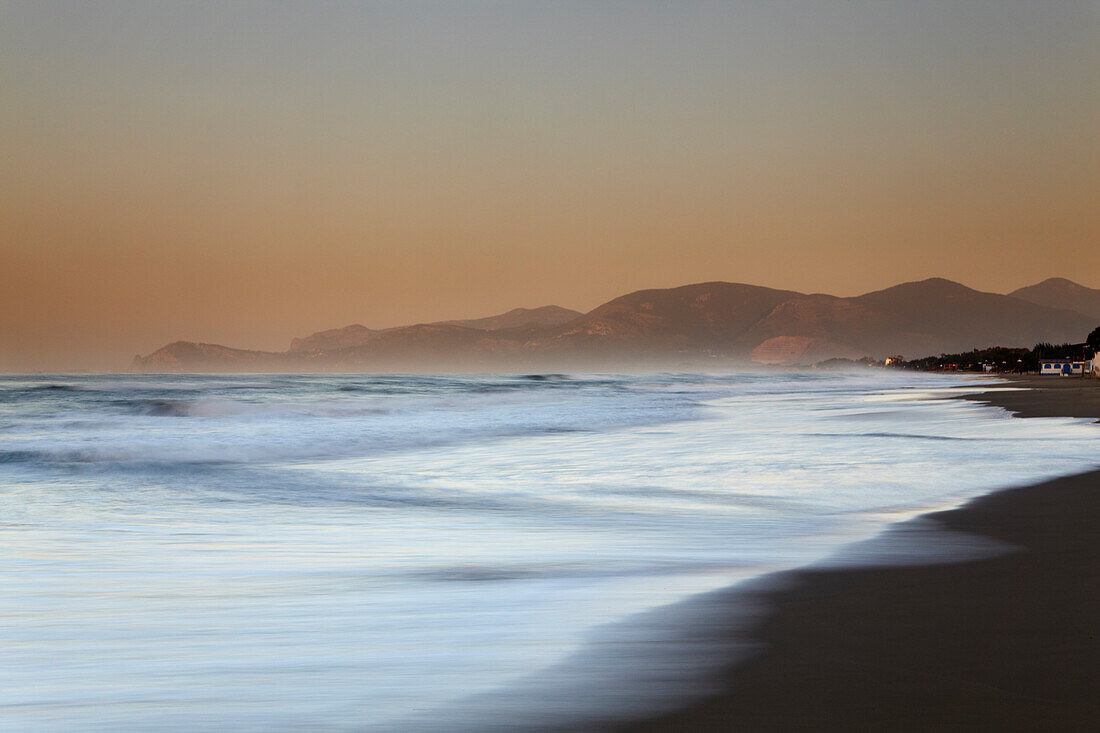 Sunrise on the western beach at Sperlonga, Lazio, Italy.; Sperlonga, Mediterranean Sea, Lazio province, Italy.