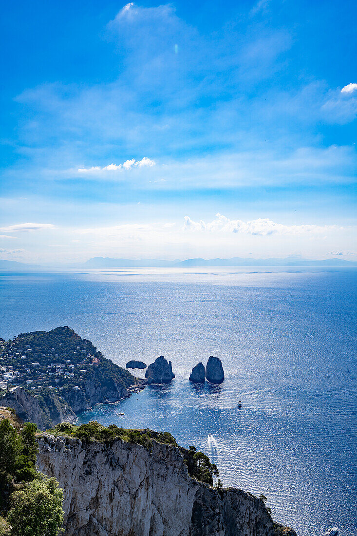 View of Faraglioni Bay and rock formations from Monte Solaro on the Island of Capri; Naples, Capri, Italy