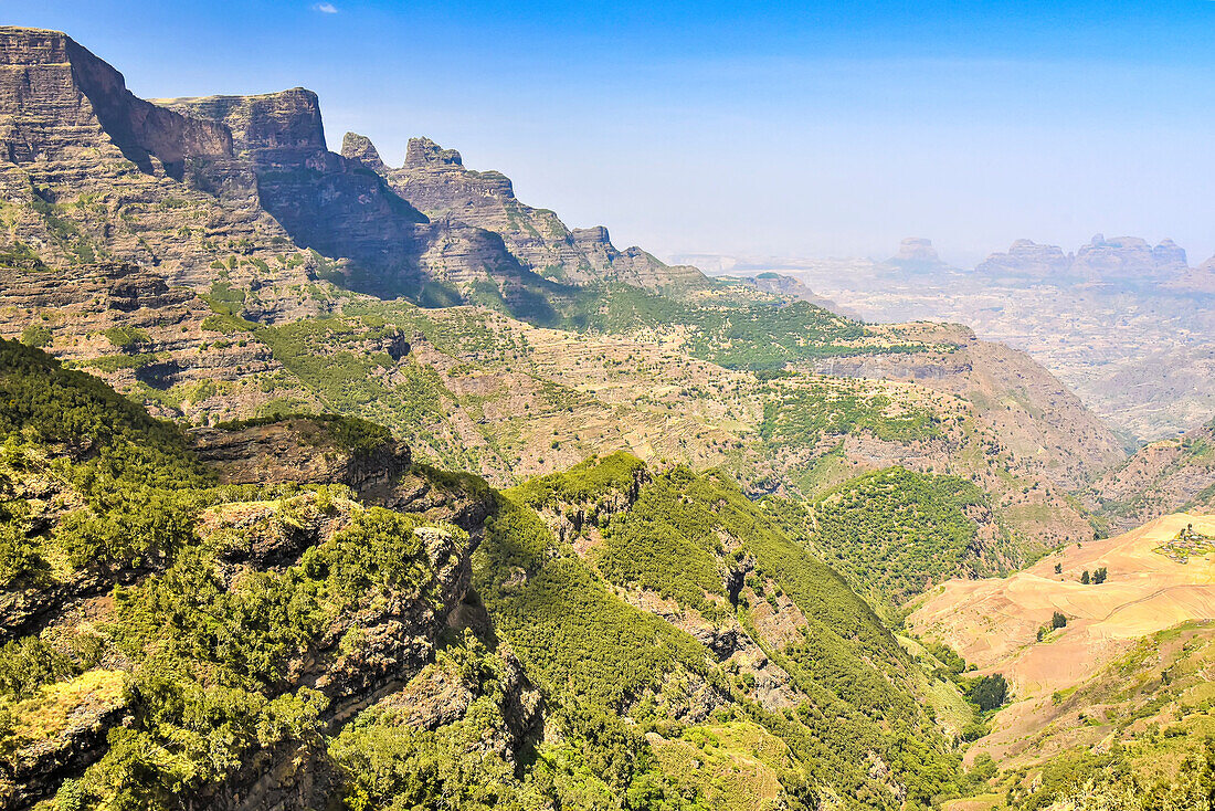 Scenic view of mountain peaks and rocky cliffs covered with trees and plants in the Simien Mountains National Park in Northern Ethiopia; Ethiopia