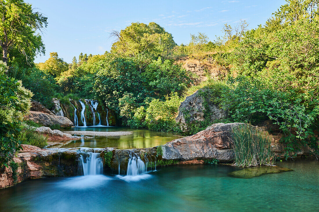 Scenic beauty of the cascading waterfalls at El Parrizal Beceite along the Matarranya River (Río Matarraña) in the Province of Teruel, Autonomous Region of Aragon; Spain