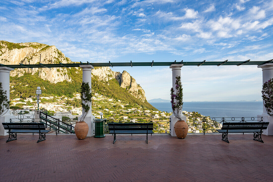 Terrace lookout with an overview of the Capri Town, on a plateau like a saddle high above the sea with the island's port, Marina Grande below; Naples, Capri, Italy