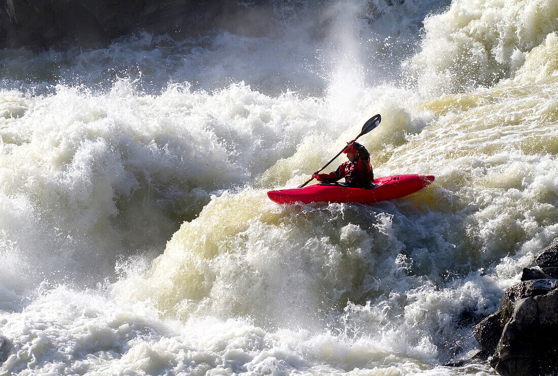 A kayaker big white water runs the lower section of Great Falls.; Potomac River, Maryland.