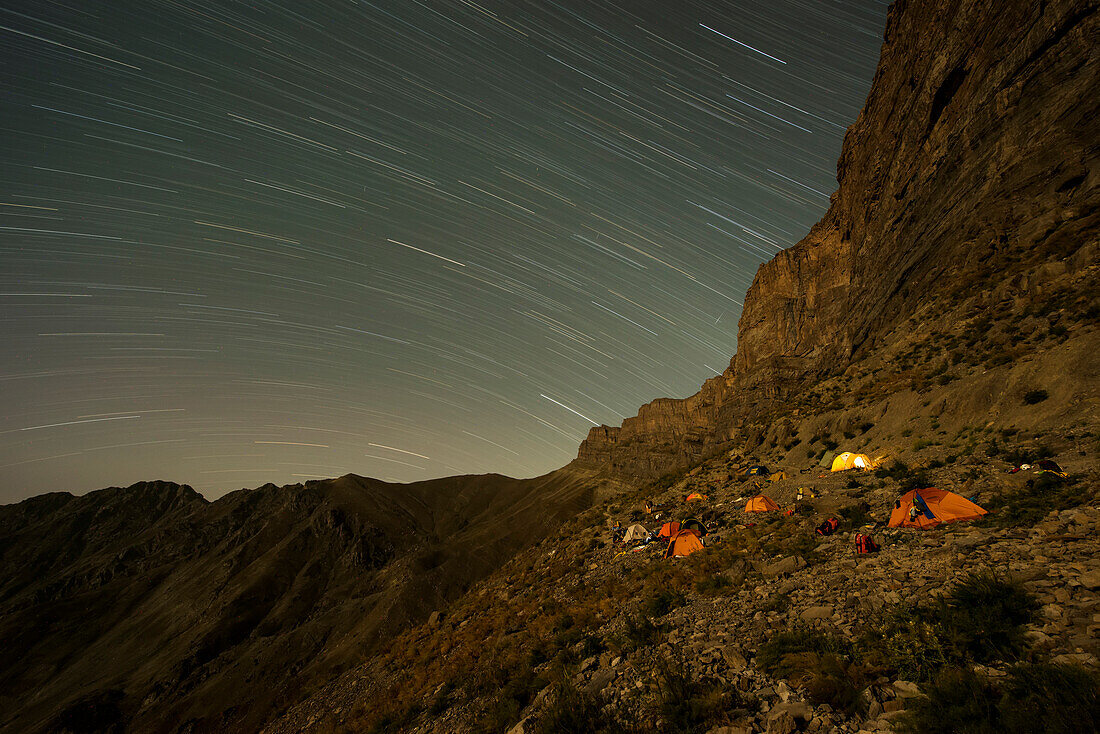 An international expedition team camps at the foot of the Boysuntov cliff.; Uzbekistan.