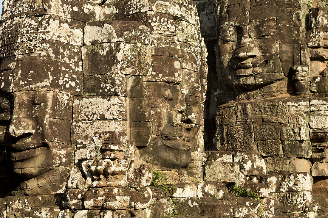 Close-up view of the stone, sculpted faces on the Bayon Temple in Angkor Thom; Angkor Wat Archaeological Park, Siem Reap, Cambodia