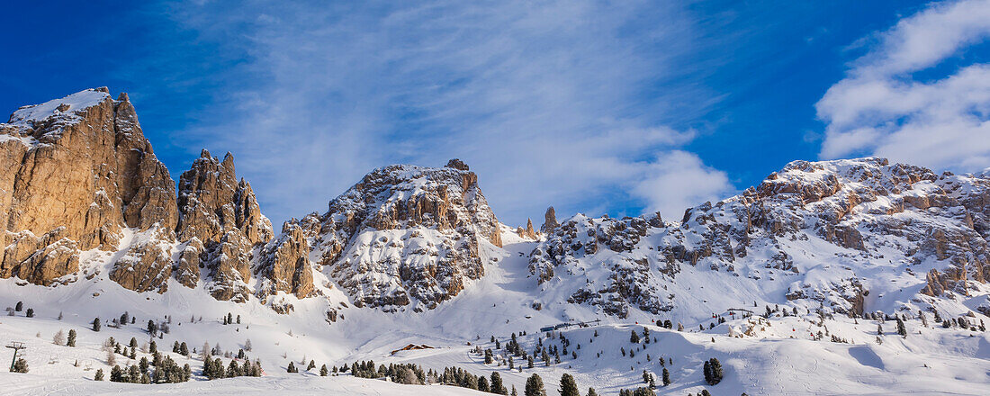 Snow covered, jagged mountain peaks of the Cir Group near the Gardena Pass in the Val Gardena; Trentino Alto Adige, Dolomites, Italy
