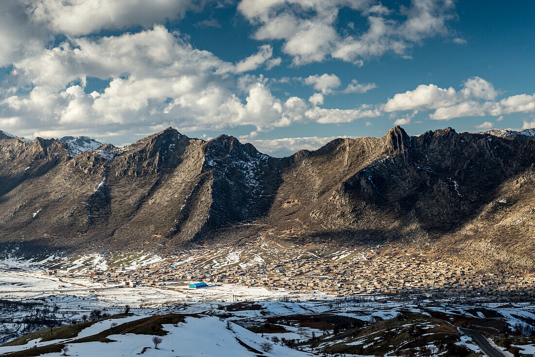 Town at the base of the Zagros Mountains in Iranian Kurdistan Region in winter; Kermanshah, Iran