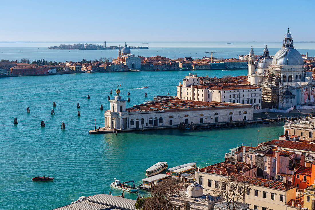 Venetian Lagoon and harbor entrance to the City of Venice with Chiesa Santa Maria della Salute on the Punta della Dogana as viewed from the bell tower of St Mark, with the Church of Redentore on the Giudecca Island; Veneto, Venice, Italy