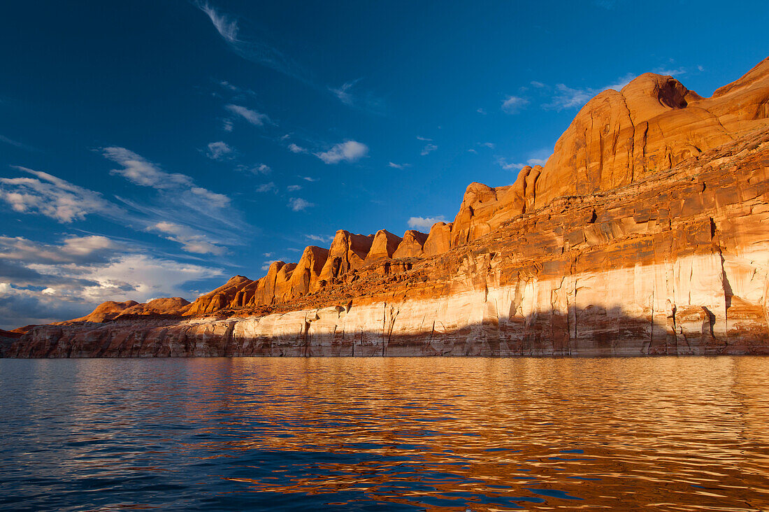 Afternoon light and reflections on the surface of Lake Powell in Glen Canyon National Recreation Area, Utah, USA; Utah, United States of America