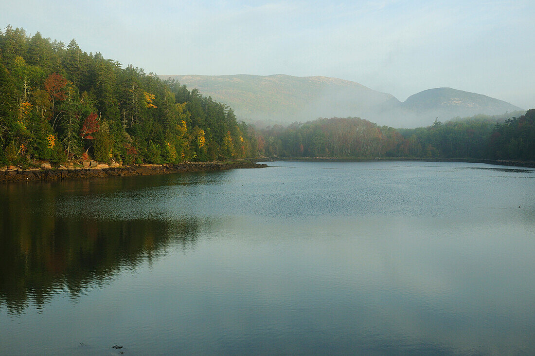 Scenic view of Jordan Pond and surrounding hills and forests in fall.; Acadia National Park, Mount Desert Island, Maine.
