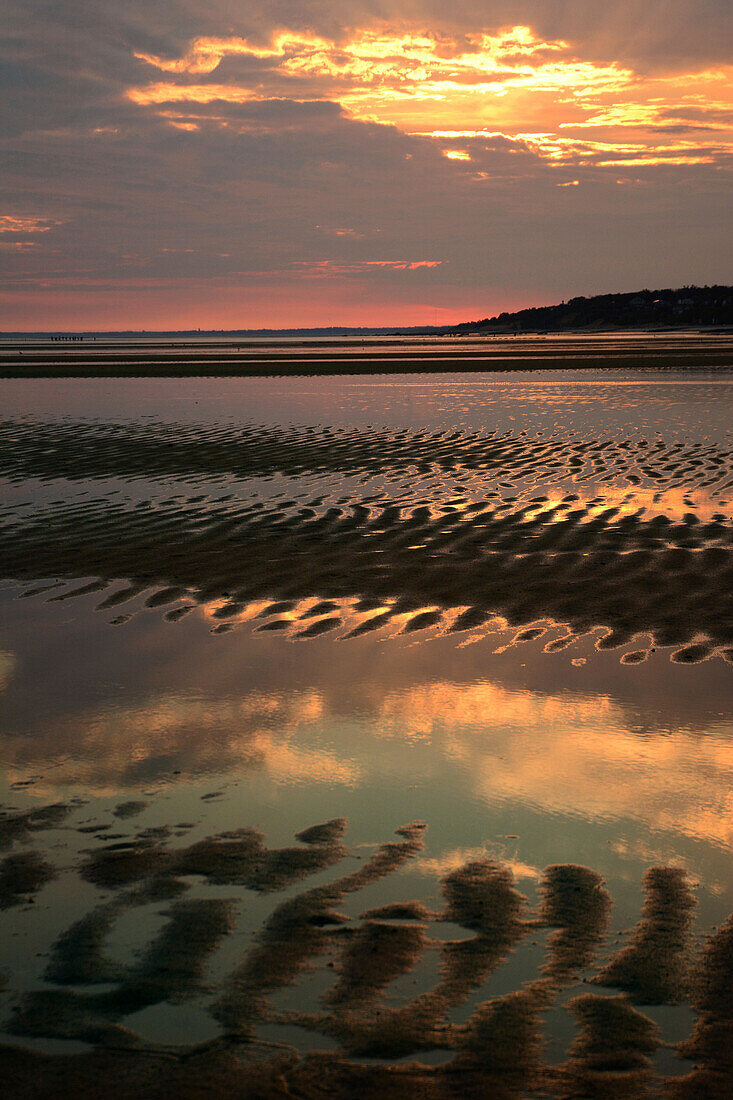 sunrise over the tidal flats in Brewster, Massachusetts, in summer.; Brewster, Massachusetts, USA.