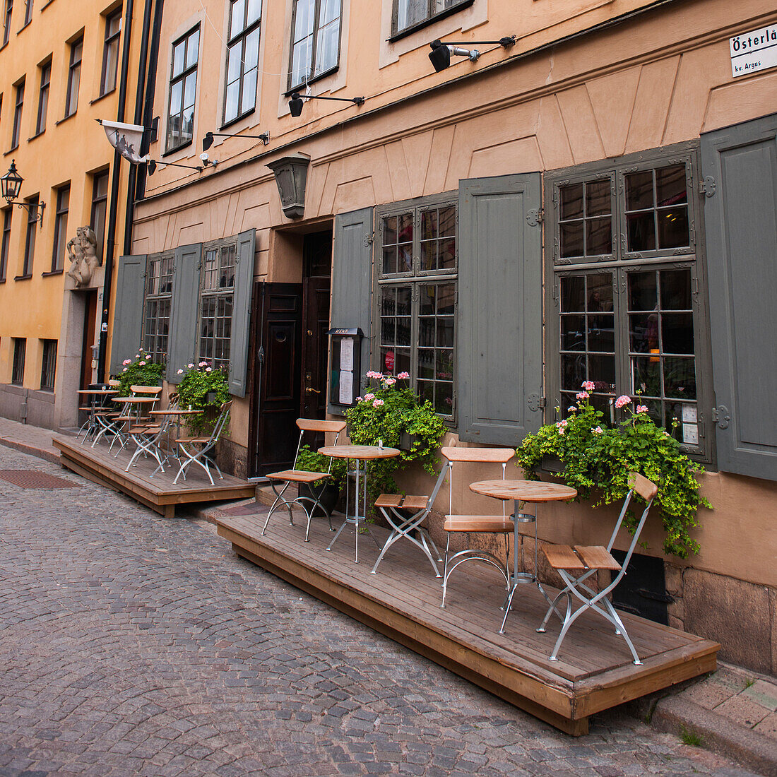 Small Tables And Chairs On A Patio Outside A Restaurant; Stockholm Sweden