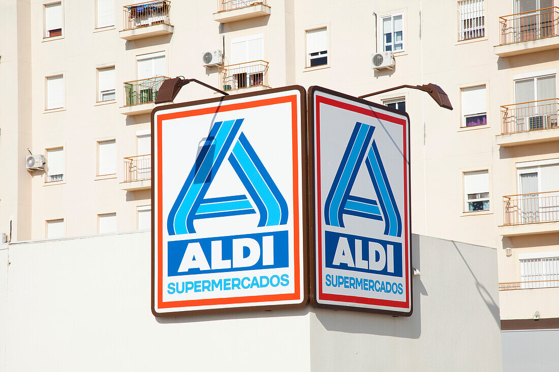 A Sign For A Supermarket On The Side Of A Building; San Fernando Andalusia Spain