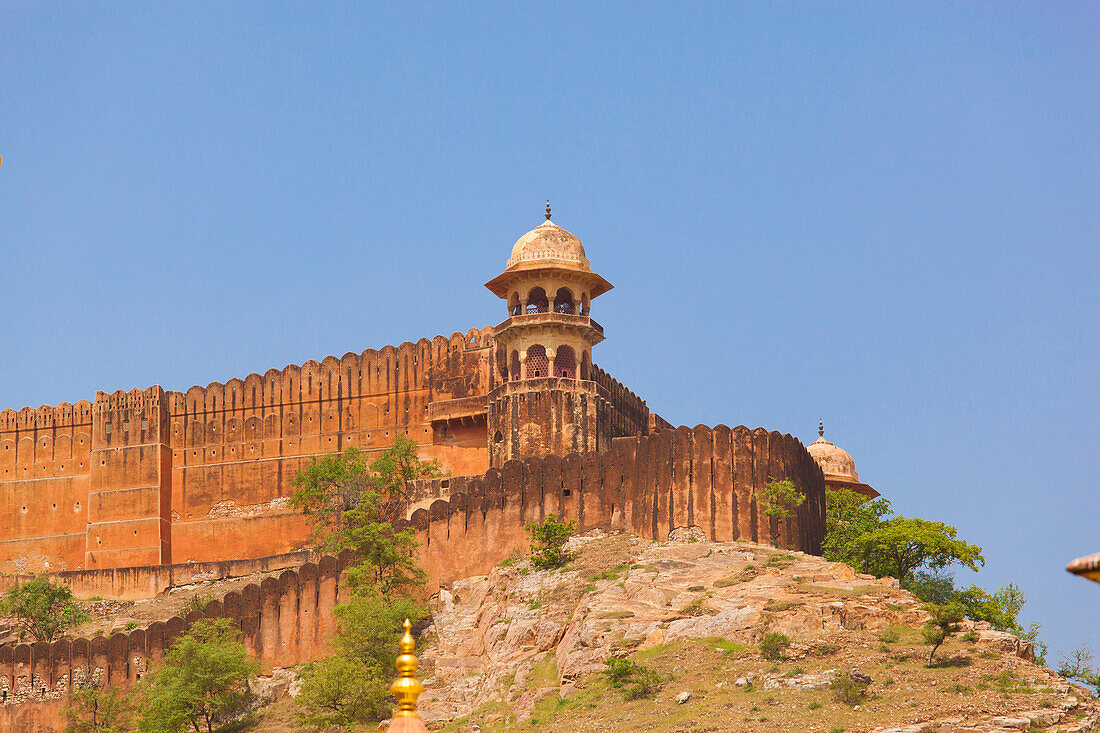 A Tower And Wall At The Corner Of Amer Fort Against A Blue Sky; Jaipur Rajasthan India