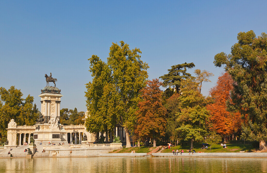 The Lake In El Retiro Gardens With The Monument To King Alfonso Xii In Background; Madrid Spain