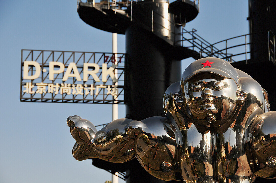 Shiny Metal Sculpture And Black Metal Stairway With A Parking Sign Against A Blue Sky; Beijing China