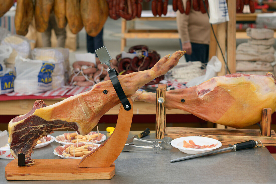 Jamon Serrano Dry-Cured Spanish Ham On A Stand At The Ham And Cheese Festival; Campillos Malaga Spain