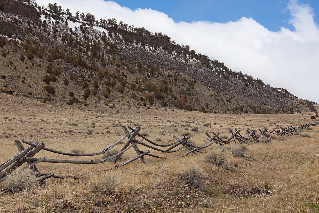 Wooden Fence In A Rural Area With Mountains Near Bozeman; Montana United States Of America