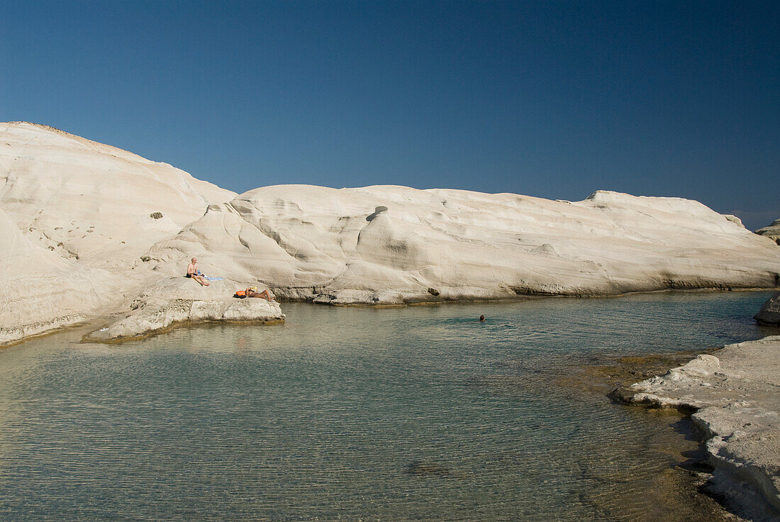 Greece, Cyclades, Island of Milos, Volcanic formations make up Sarakiniko Beach.