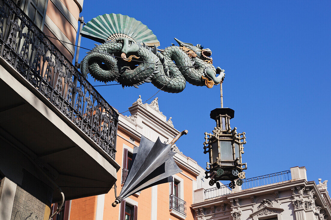Chinese Dragon And Umbrella At Casa Dels Paraigues On The Ramblas; Barcelona Spain
