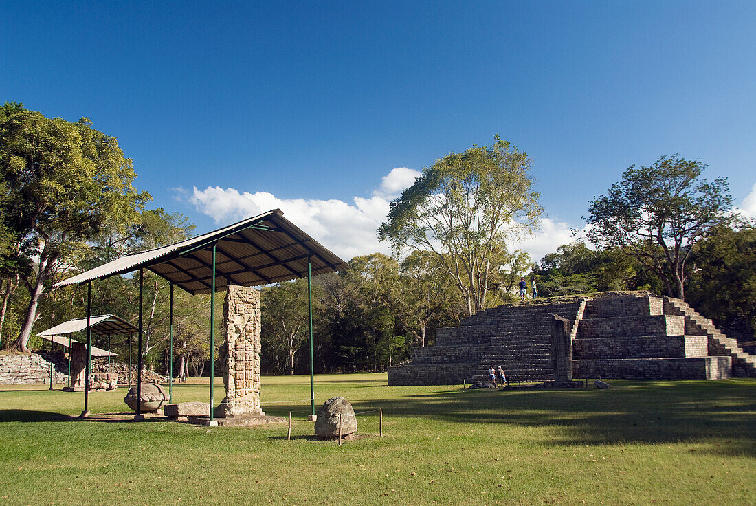 Honduras, Copan Ruinas, Copan Archeological Park, Stela 4 (left), Mound # 4 (right)