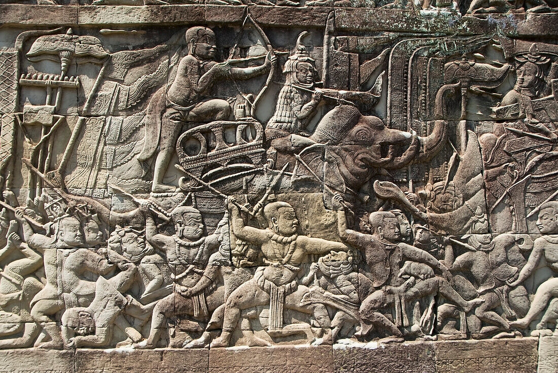 Cambodia, Siem Reap, Angkor Thom, Angkor Archaeological Park, Story carved onto exterior of building.