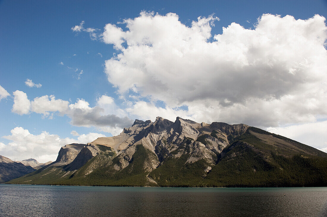Shoreline Of A Lake Against A Mountain; Banff Alberta Canada