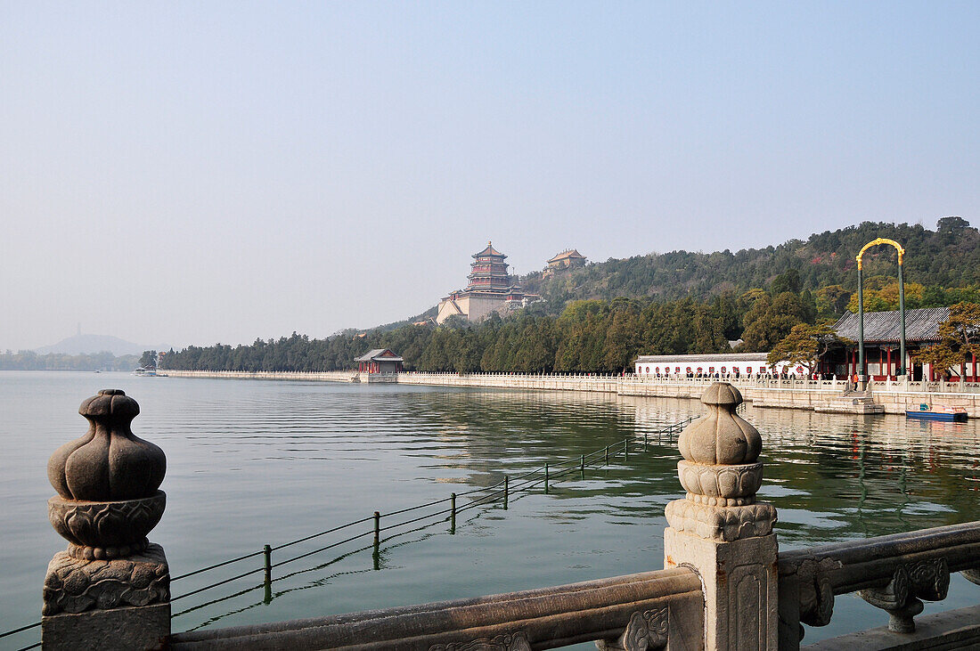 Decorative Balusters And Buildings Along The Water's Edge; Beijing China