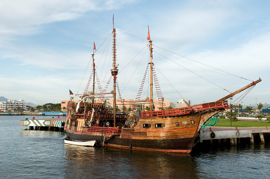 A Wooden Ship Docked By The Water's Edge; Puerto Vallerta Mexico