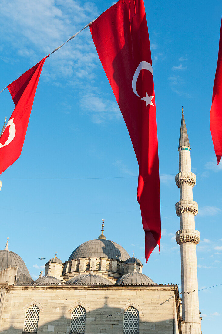 Flags Flying In Front Of The New Mosque; Istanbul Turkey