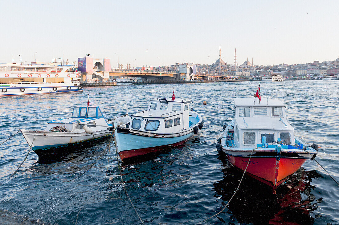 Boats Tied To The Shore In The Bosphorus River; Istanbul Turkey