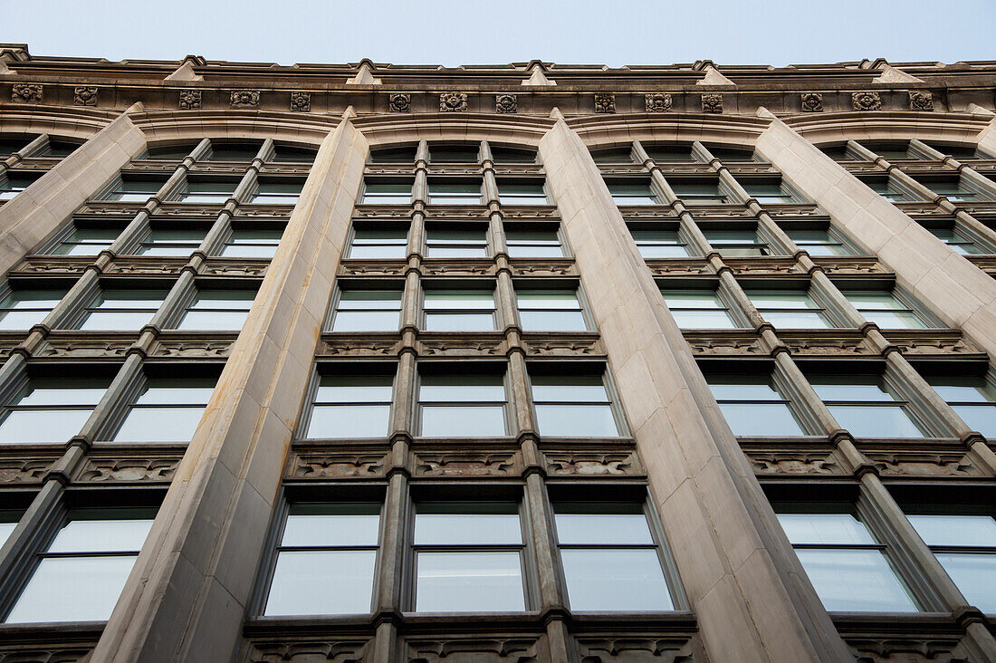 Low Angle View Of Windows On The Side Of A Building; Montreal Quebec Canada