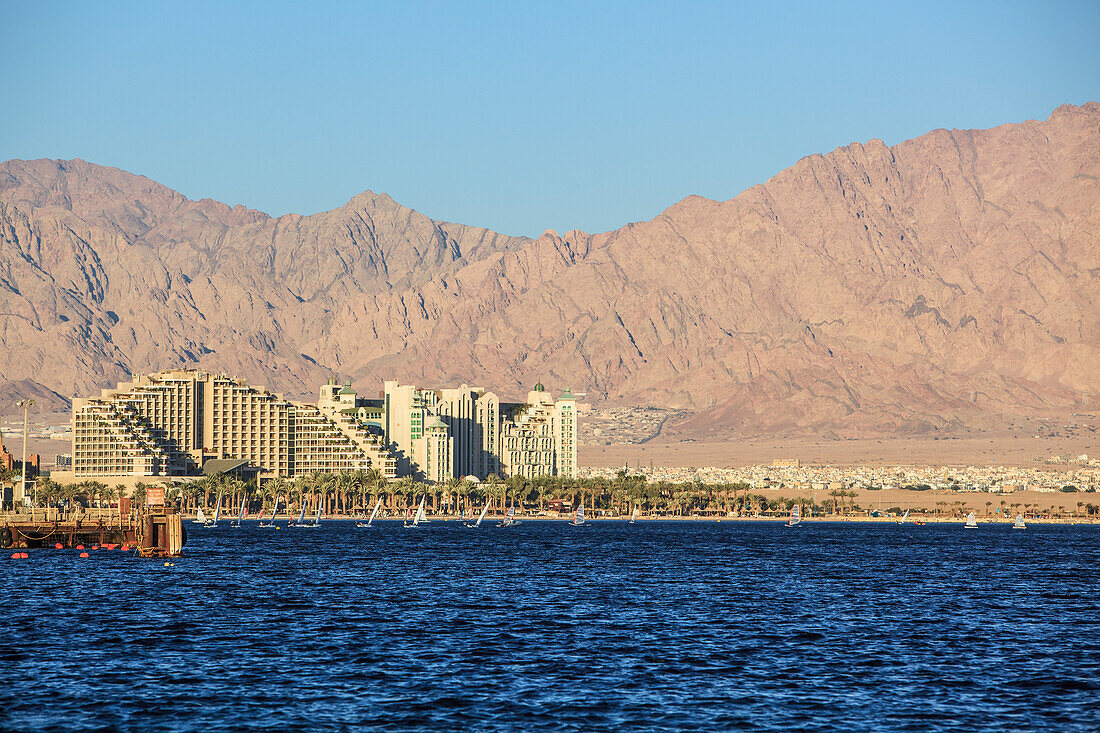 A Large Building And Mountains Along The Coast Of The Red Sea; Jordan Israel