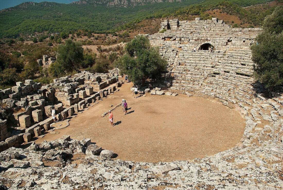 Turkey, Kaunos, Well preserved theatre with four people standing on stage