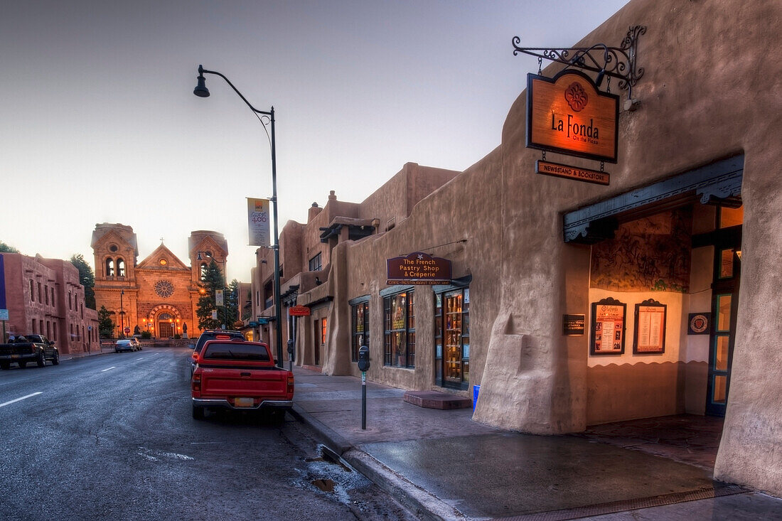 East San Francisco Street looking toward St. Francis of Assisi Cathedral and La Fonda Hotel at dawn; Santa Fe, New Mexico, USA