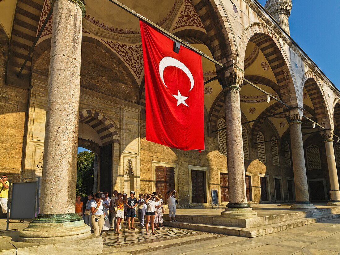 Turkey, Istanbul, Turkish flag at entrance to Blue Mosque