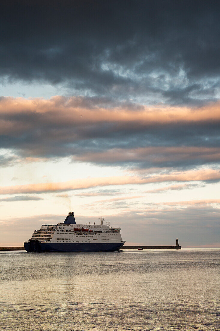 Cruise ship along pier at sunset; South Shields, Tyne and Wear, England, UK