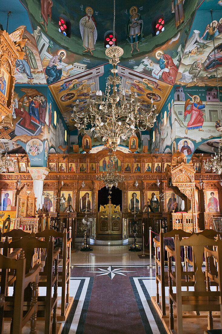 Interior of St Raphael church with colorful paintings on walls; Pachyammos, Cyprus
