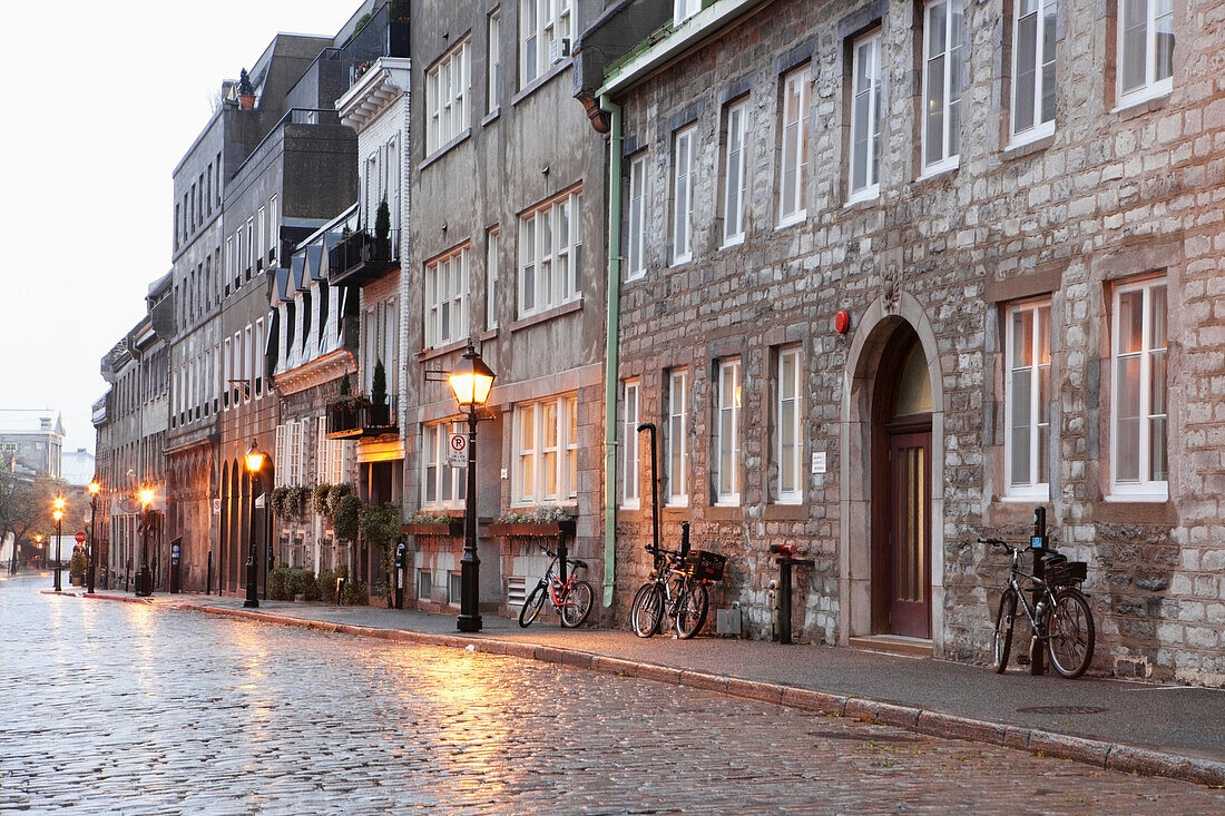 Canada, Quebec, Cobblestone street wet after the rain; Montreal