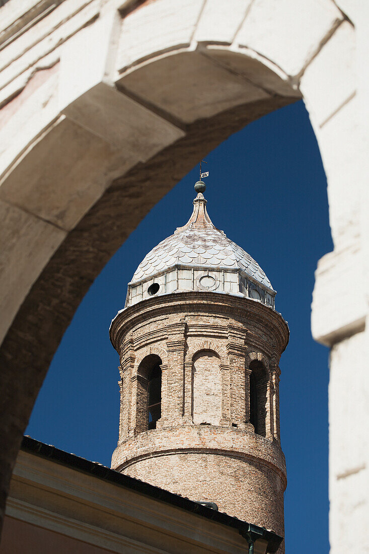 Basilica Di San Vitale turret with dome framed with stone archway; Ravenna, Emilia-Romagna, Italy