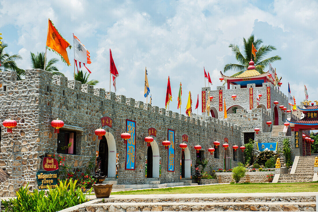 Thailand, Flags and lanterns line outside of building in Chinese village; Shandicun